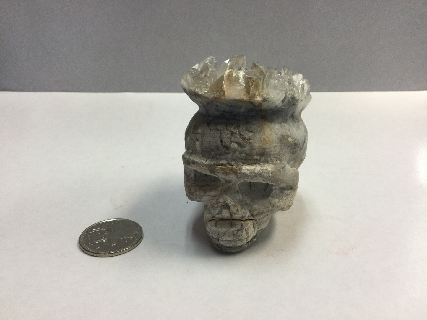 Carved Stone Skull with Clear Quartz Crown
