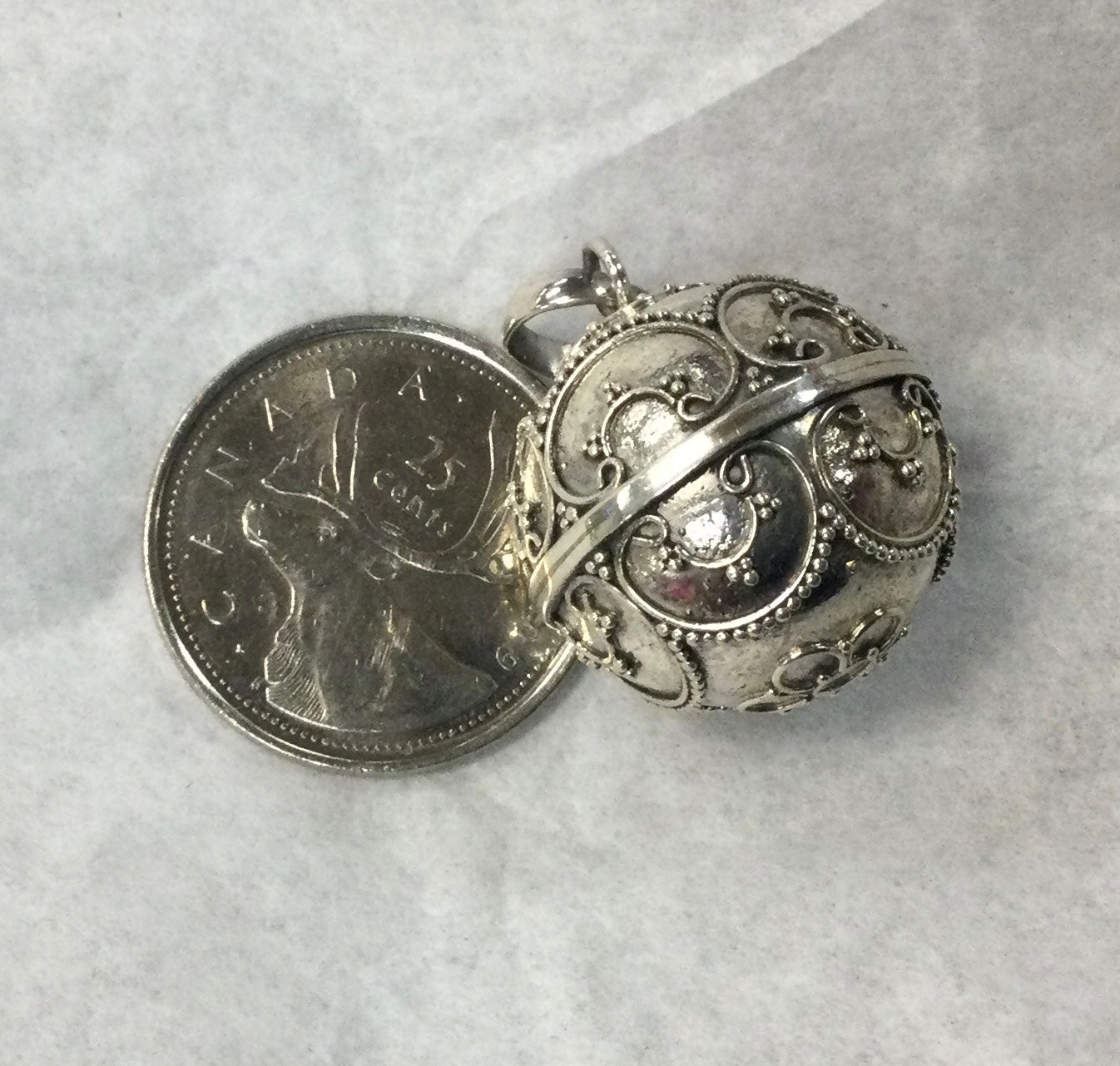 Ornate Silver Musical Ball Pendant