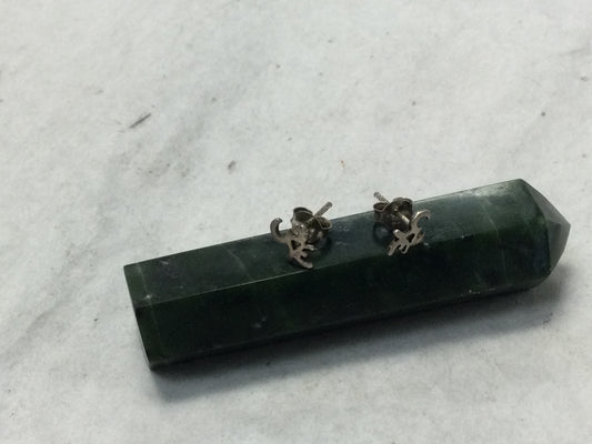 various silver studs (om, feathers, Buddha, etc.)