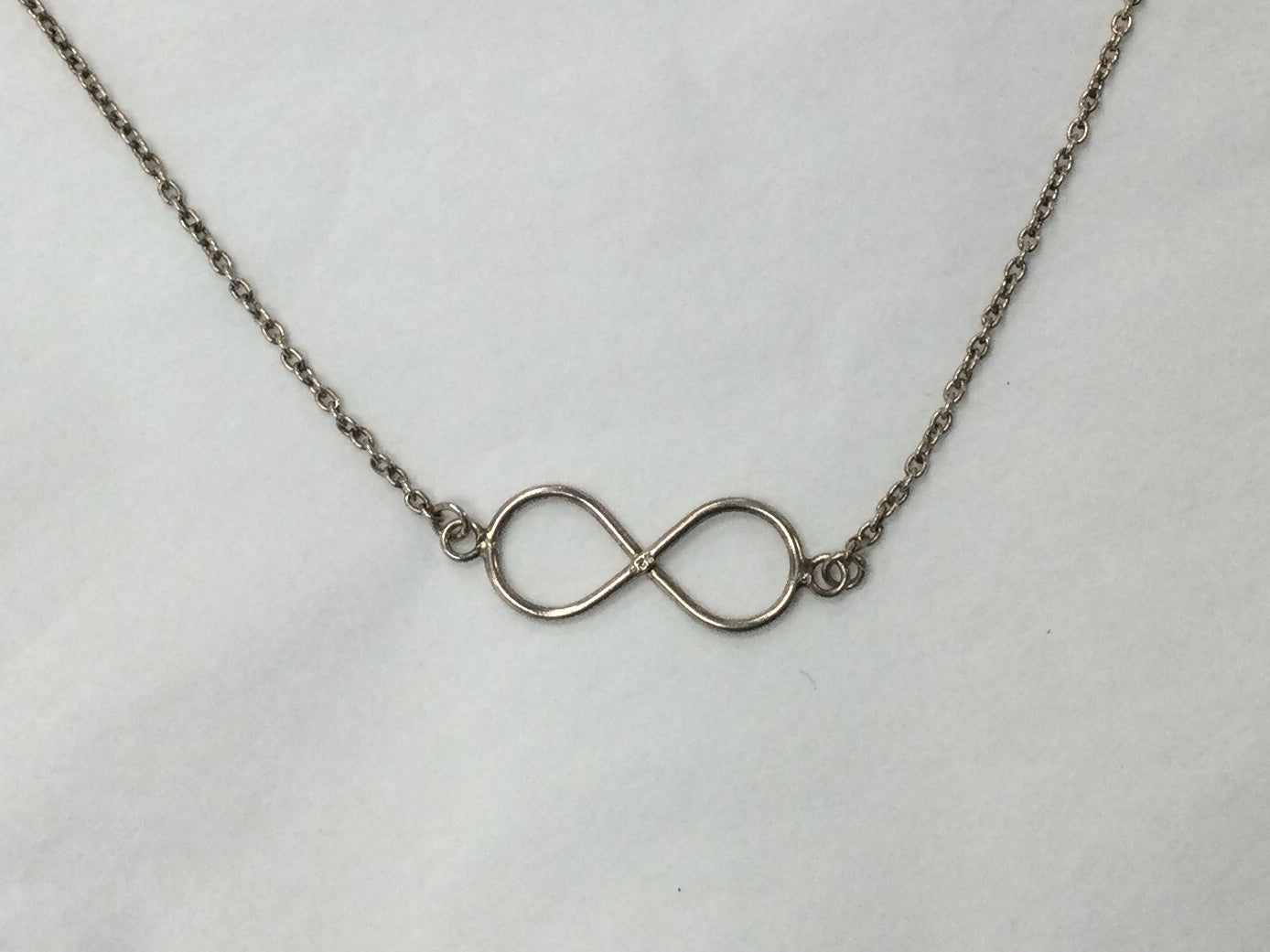 Silver Necklace With Attached Infinity Pendant
