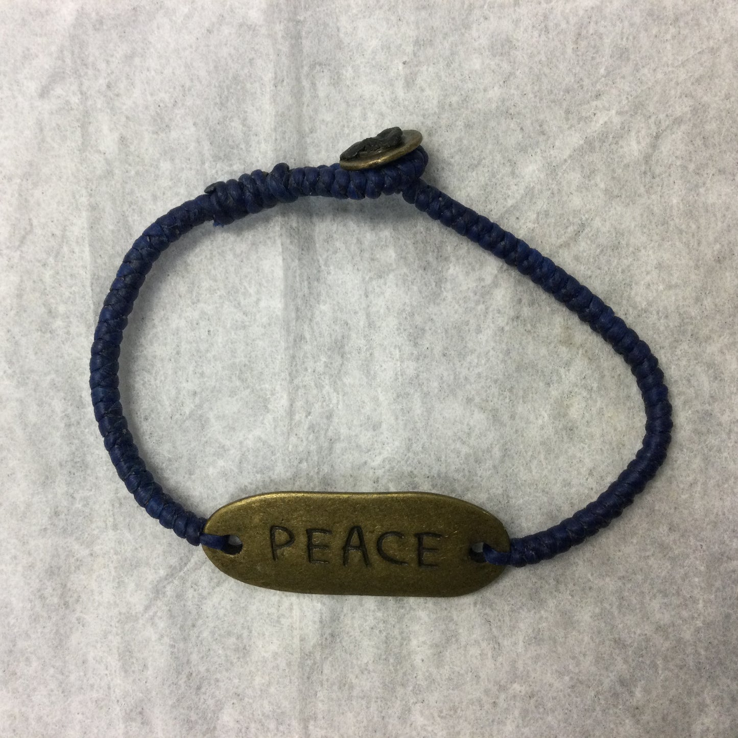 Woven Wax Cord Bracelet with Brass Peace Plaque