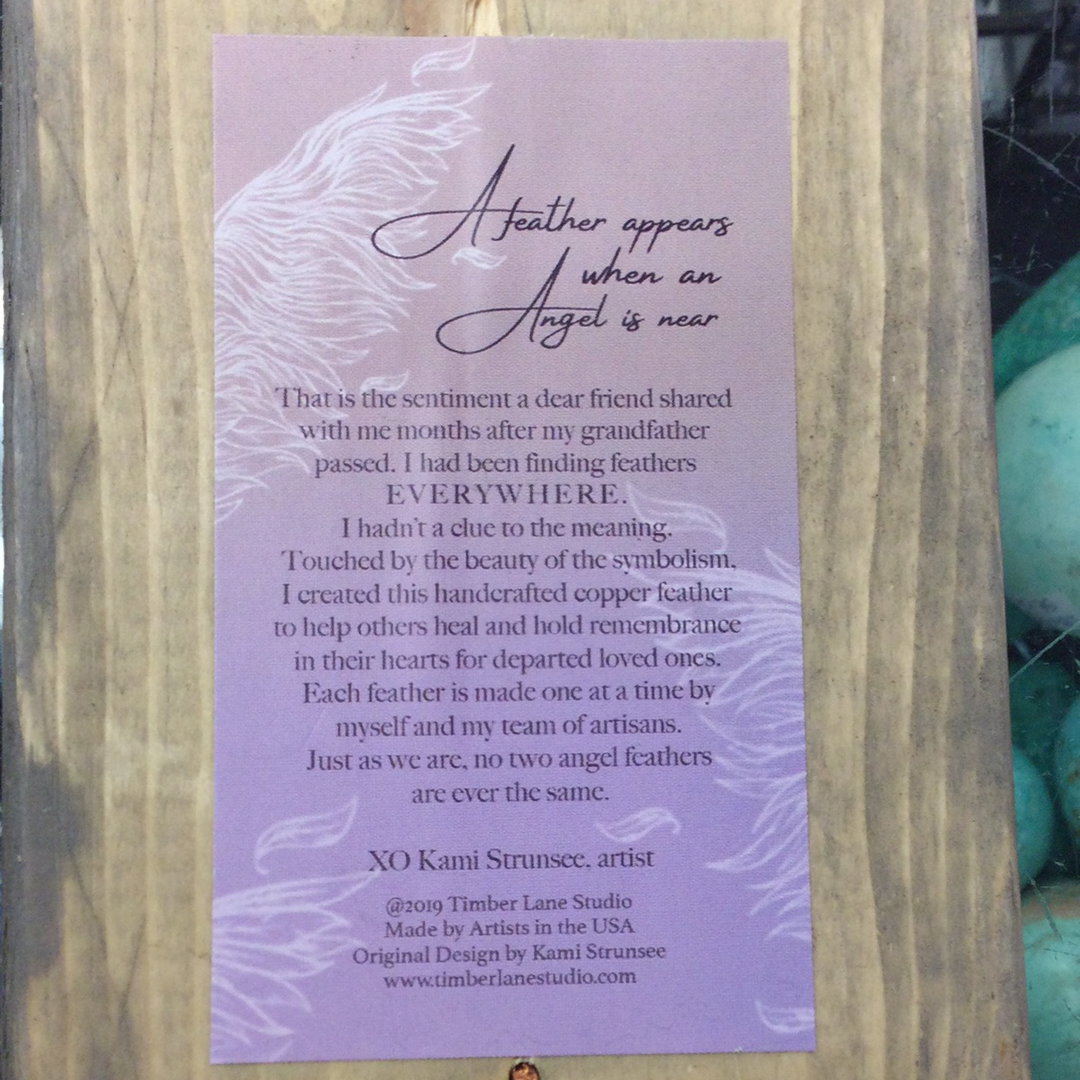 Copper Angel Feather on wood