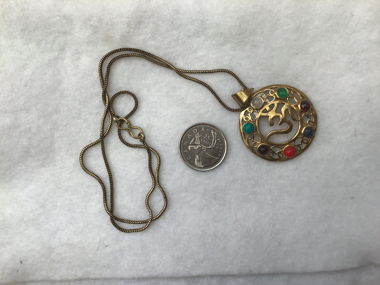chakra pendant with OM in middle
