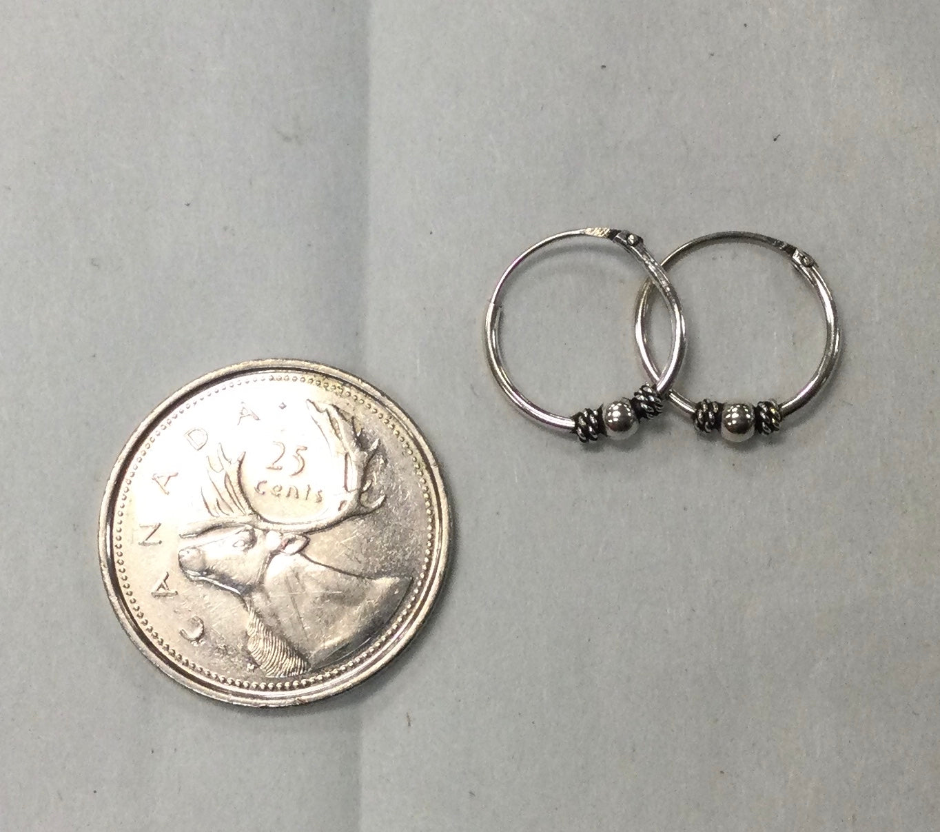 Silver hoop earrings with ball and coil 0.5”