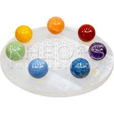 Selenite charging plate with seven chakra spheres