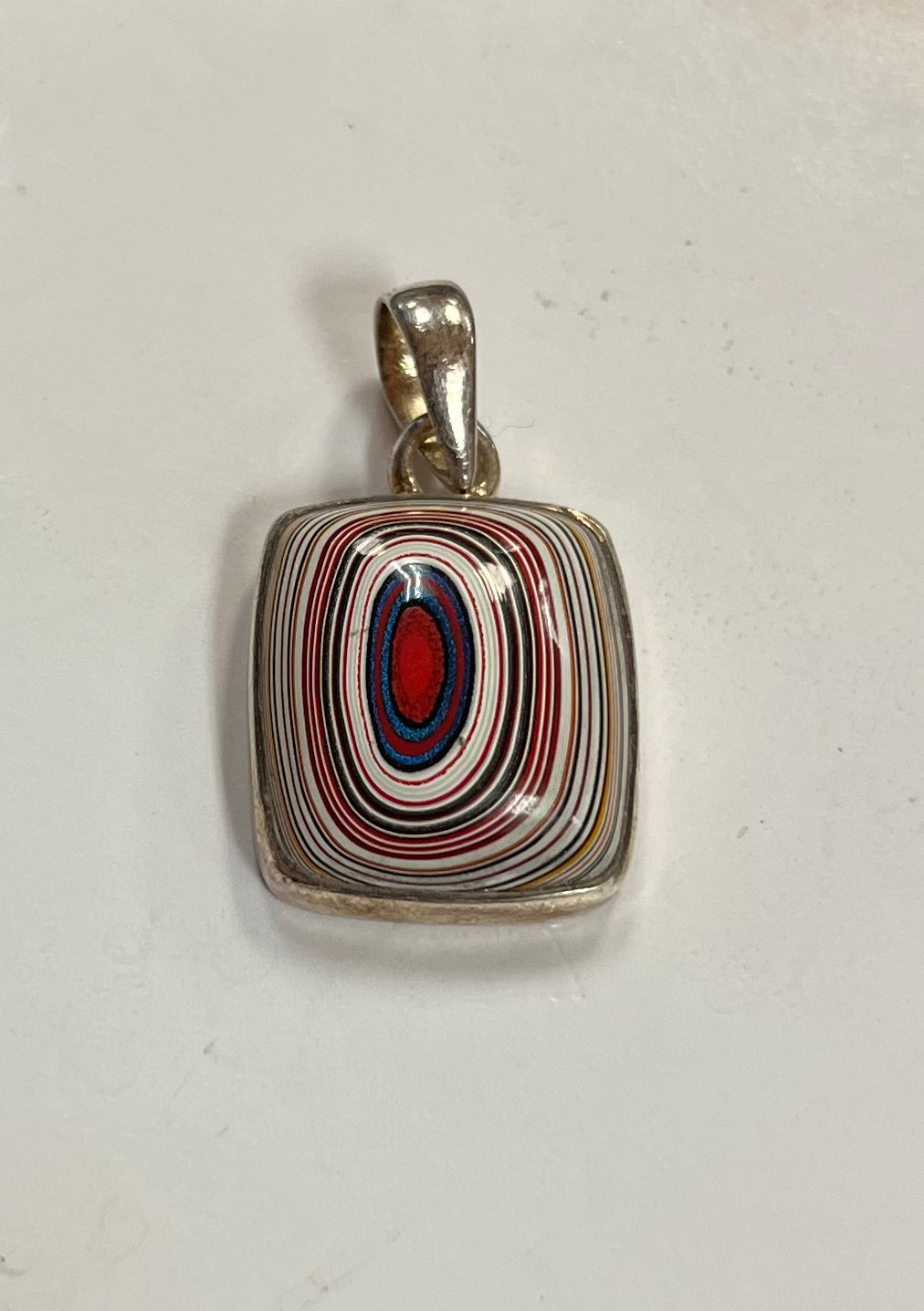 Red Center Layered Fordite Pendant in Silver