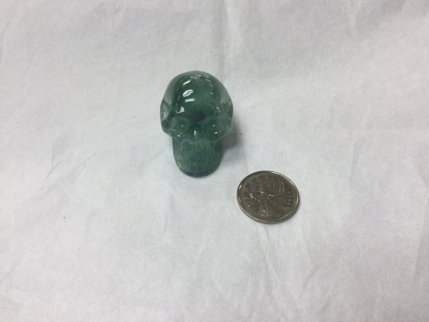 Green and purple fluorite skull