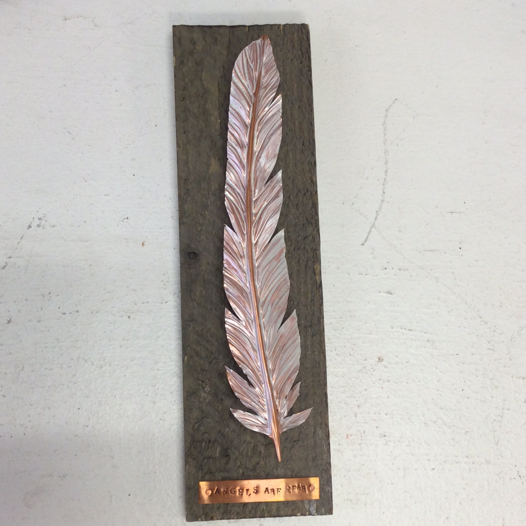 Copper Angel Feather on wood