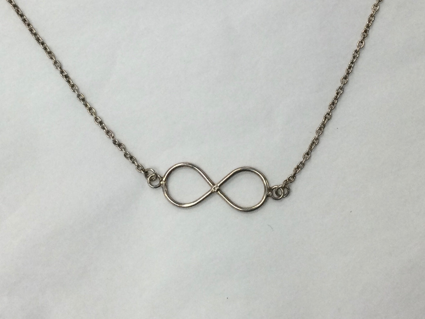 Silver Necklace With Attached Infinity Pendant