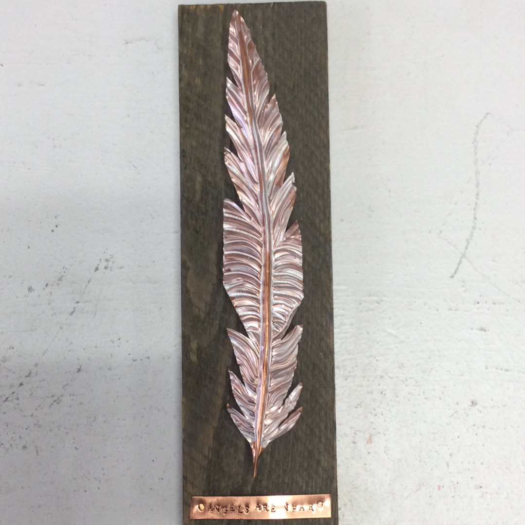 Copper Angel Feather on wood